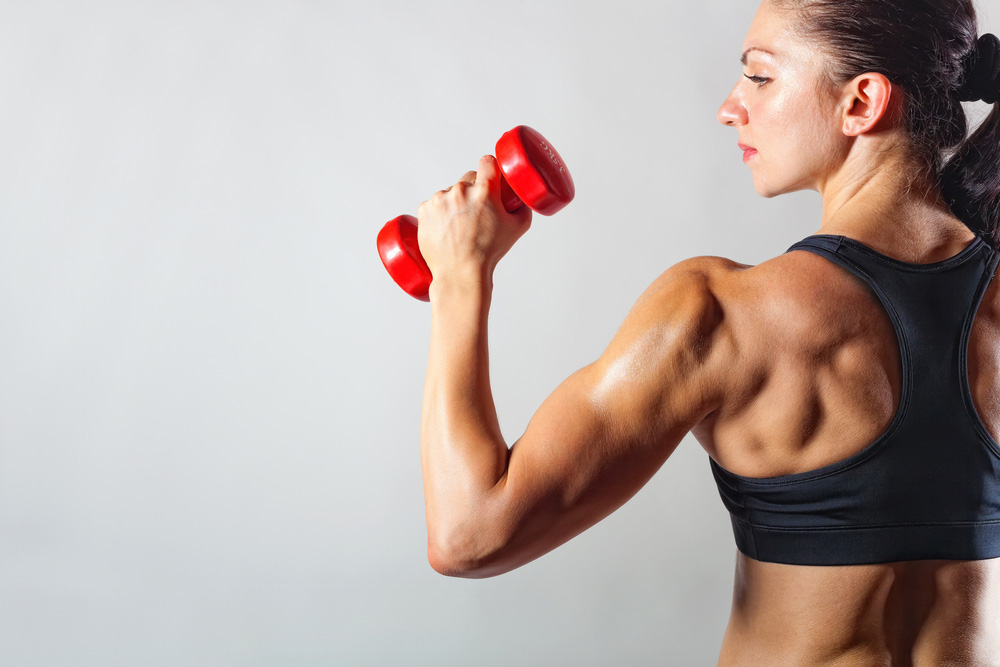 Woman with red dumbbell